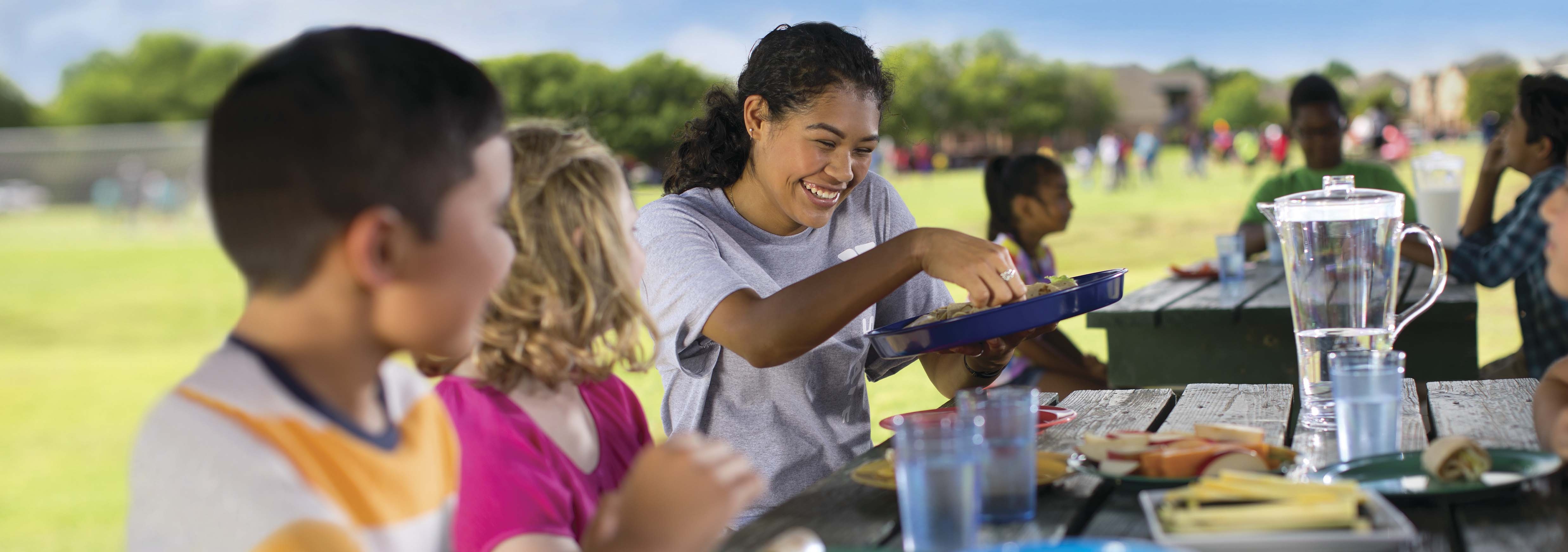 YMCA kids at picnic table