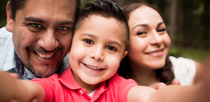 Parents and child taking a selfie together