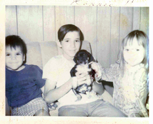 The author and her two brothers in a sepia toned photo